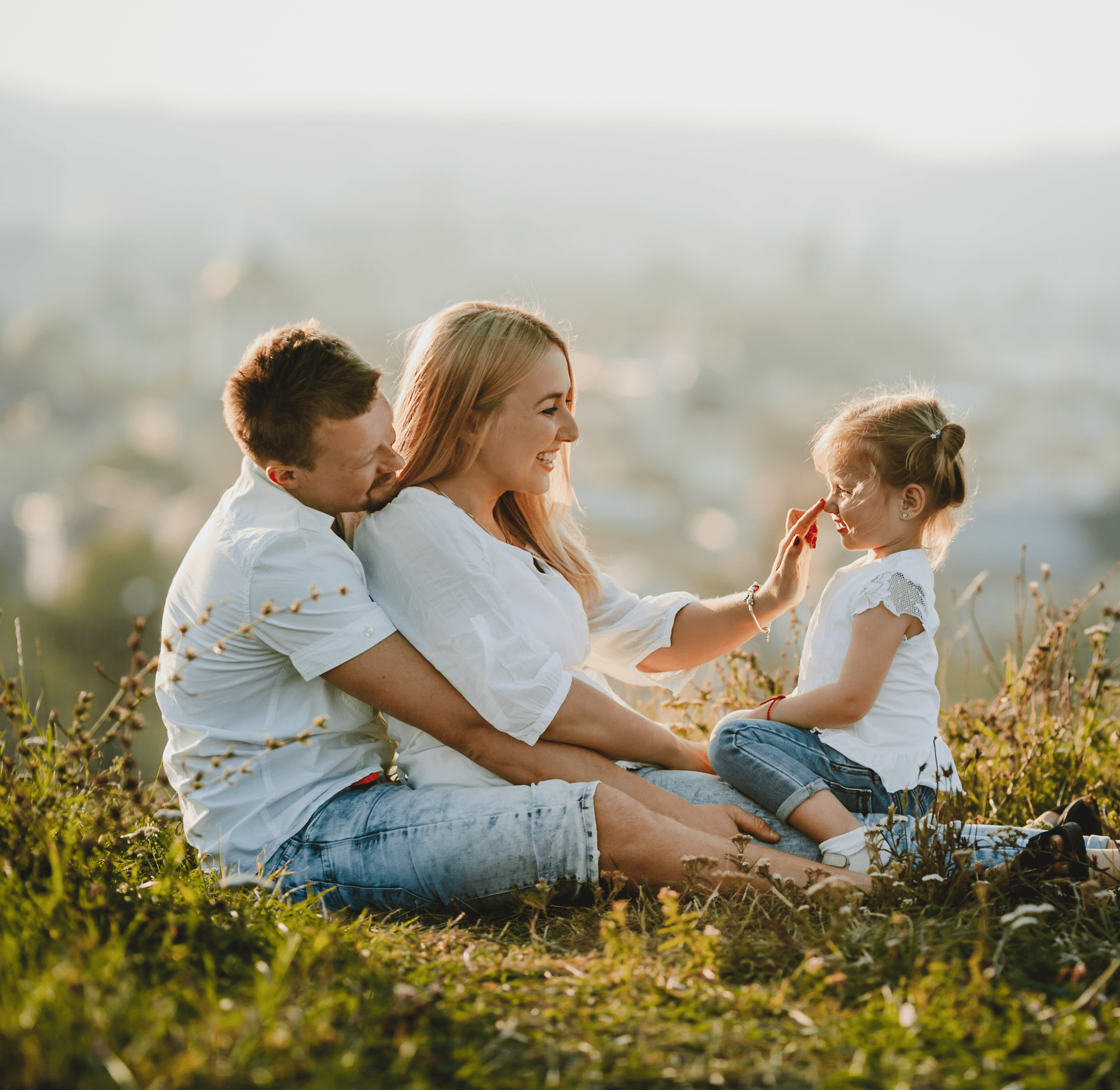 happy-parents-their-little-girl-rest-lawn-beautiful-summer-day